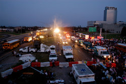 Victims of Hurricane Katrina continue to be evacuated out of the city of New Orleans by bus well into the night of August 31.