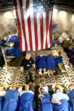 Sick and injured people being evacuated aboard a C-17 Globemaster III