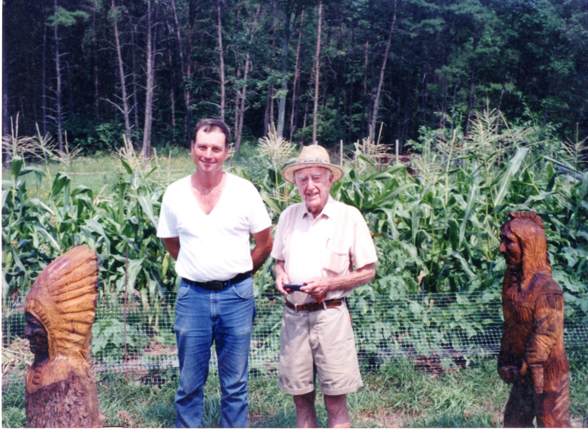 John Fichtner and George H Breiding with John's chainsaw sculptures - September 2000